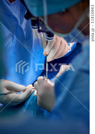 Rhinoplasty close-up of nose surgery. The hands of the surgeon working tools in white gloves Rhinoplasty close-up of nose surgery. The hands of the surgeon working tools in white gloves 51810663