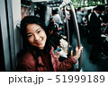 Asian girl is using subway train in Tokyo 51999189