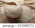 Jasmine rice in a wooden bowl and wooden spoon  52396572