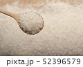 Close up view of rice in a wooden spoon 52396579