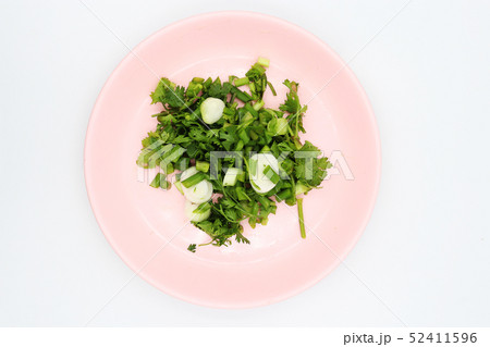 shopped coriander in pink dish on white shopped coriander in pink dish on white 52411596