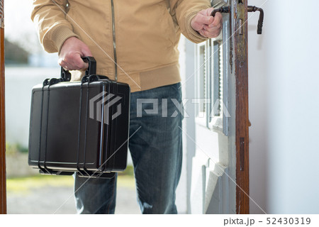 man with a black suitcase going home man with a black suitcase going home 52430319
