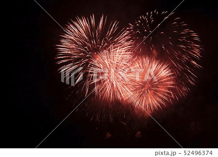 Fireworks against the dark sky. Bright salute in the black sky, Fireworks against the dark sky. Bright salute in the black sky, 52496374