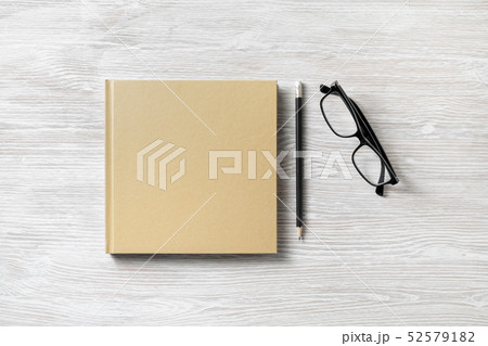 Book, glasses, pencil 52579182