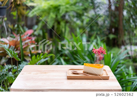Passion fruit cheesecake serve on wood tay and Passion fruit cheesecake serve on wood tay and 52602562