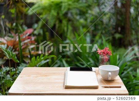 Workspace outdoors with memo notebook,pencil,white Workspace outdoors with memo notebook,pencil,white 52602569
