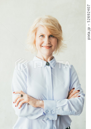 smiling confident business female arms folded ceo smiling confident business female arms folded ceo 52692407