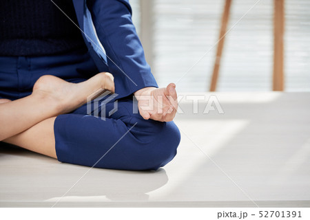 Woman doing yoga at office 52701391