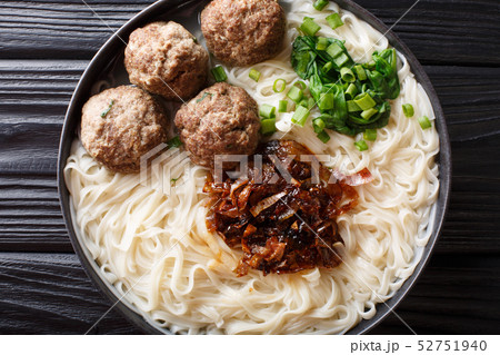 Bakso meatballs with noodles, fried onions, greens 52751940