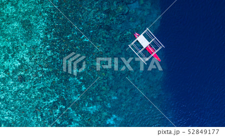 Aerial view of Filipino boats floating on top of 52849177