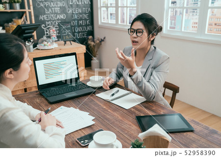 colleague during work meeting in coffee shop. colleague during work meeting in coffee shop. 52958390