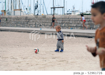Baby Playing With a Soccer Ball Baby Playing With a Soccer Ball 52961726