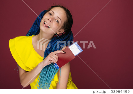 A modern trendy smiling woman in yellow dress with 52964499