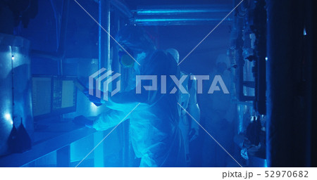 Scientists and robot conducting maintenance work 52970682