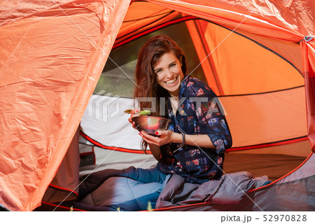 Happy tourist girl have lunch in tent 52970828