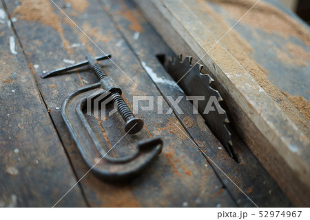 Close up vintage table saw and c clamp Close up vintage table saw and c clamp 52974967