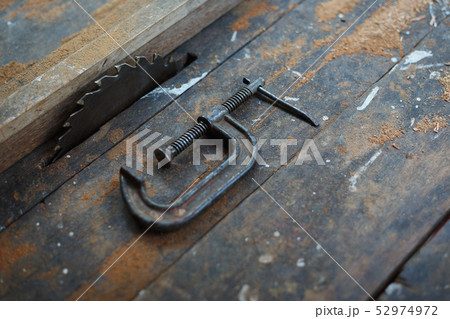 Close up vintage table saw and c clamp Close up vintage table saw and c clamp 52974972