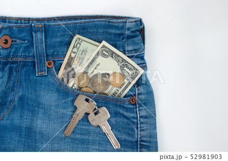 Ready money and keys to the house in pocket jeans. 52981903