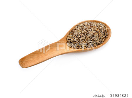 caraway seeds in wood spoon on white background caraway seeds in wood spoon on white background 52984325