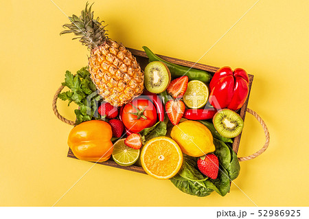 Fruits and vegetables rich in vitamin C in box. Fruits and vegetables rich in vitamin C in box. 52986925