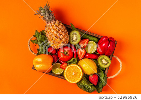 Fruits and vegetables rich in vitamin C in box. 52986926