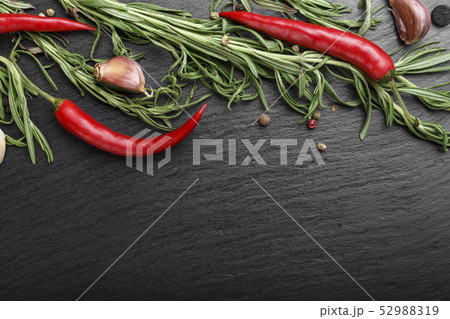 spices with hot pepper on a black background 52988319