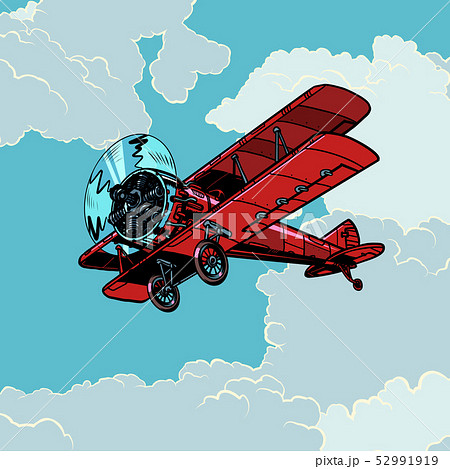 retro biplane plane flying in the clouds 52991919