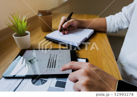 Businessman using tablet to the situation. 52993278