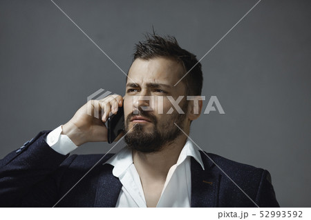 Man in Suit With a Smartphone 52993592