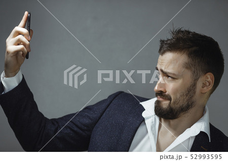 Man in Suit with Phone 52993595