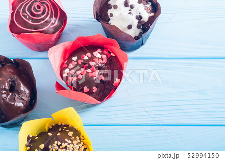 Colorful chocolate homemade muffins Colorful chocolate homemade muffins 52994150
