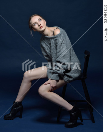 Beautiful woman in sweater in studio 52994819