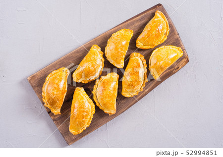 Latin American baked beef empanadas with sauce 52994851