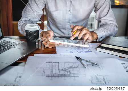 Construction engineering or architect hands 52995437