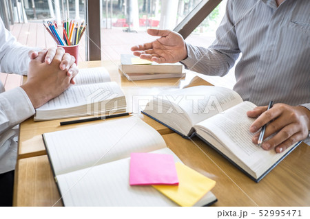 Group of young people learning studying new lesson Group of young people learning studying new lesson 52995471