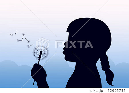 girl holding a dandelion and blowing 52995755
