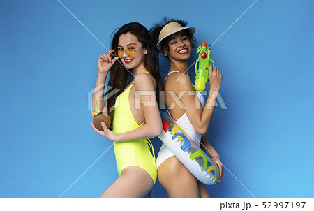 Diverse Girlfriends Enjoying Beach Party With Cocktail and Toys 52997197