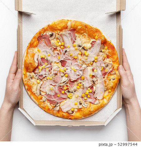 Cashier Holding Box With Delicious Pizza On White Table 52997544