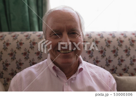 Senior man relaxing in living room at home Senior man relaxing in living room at home 53000306