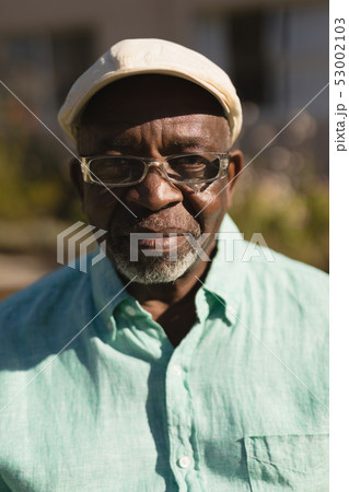 Senior man in spectacle smiling in the park Senior man in spectacle smiling in the park 53002103