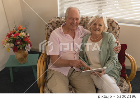 Senior couple using digital tablet at nursing home Senior couple using digital tablet at nursing home 53002196