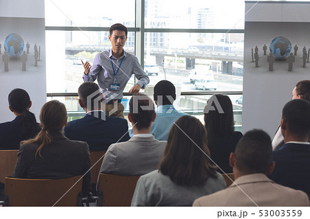 Young male professionals speaks at a business seminar 53003559
