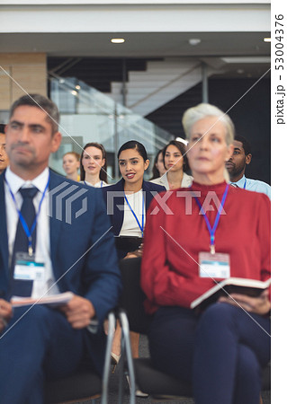 Attentive young businesswoman in a business seminar 53004376