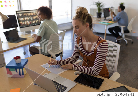 Female executive working at desk Female executive working at desk 53004541