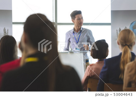 Asian businessman speaks at a business seminar Asian businessman speaks at a business seminar 53004643