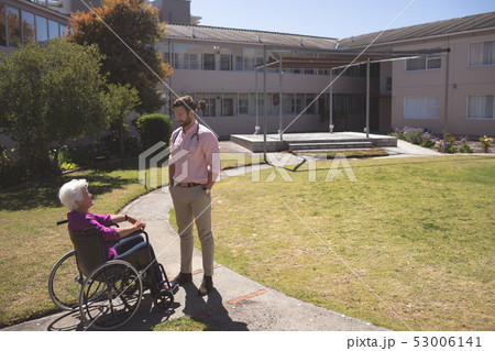 Male doctor and senior female patient interacting with each other Male doctor and senior female patient interacting with each other 53006141