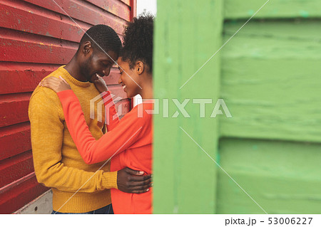 Romantic couple embracing each other in middle of beach hut 53006227