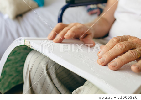 Senior male patient is reading in a retirement home Senior male patient is reading in a retirement home 53006926