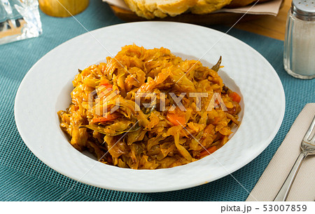 Tasty vegetarian dish – braised cabbage Tasty vegetarian dish – braised cabbage 53007859