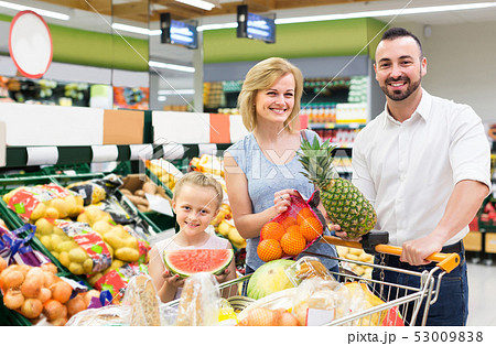 family shopping various fresh fruits in supermarket 53009838